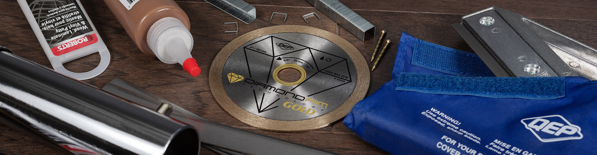 A collection of QEP and ROBERTS supplies and tool accessories