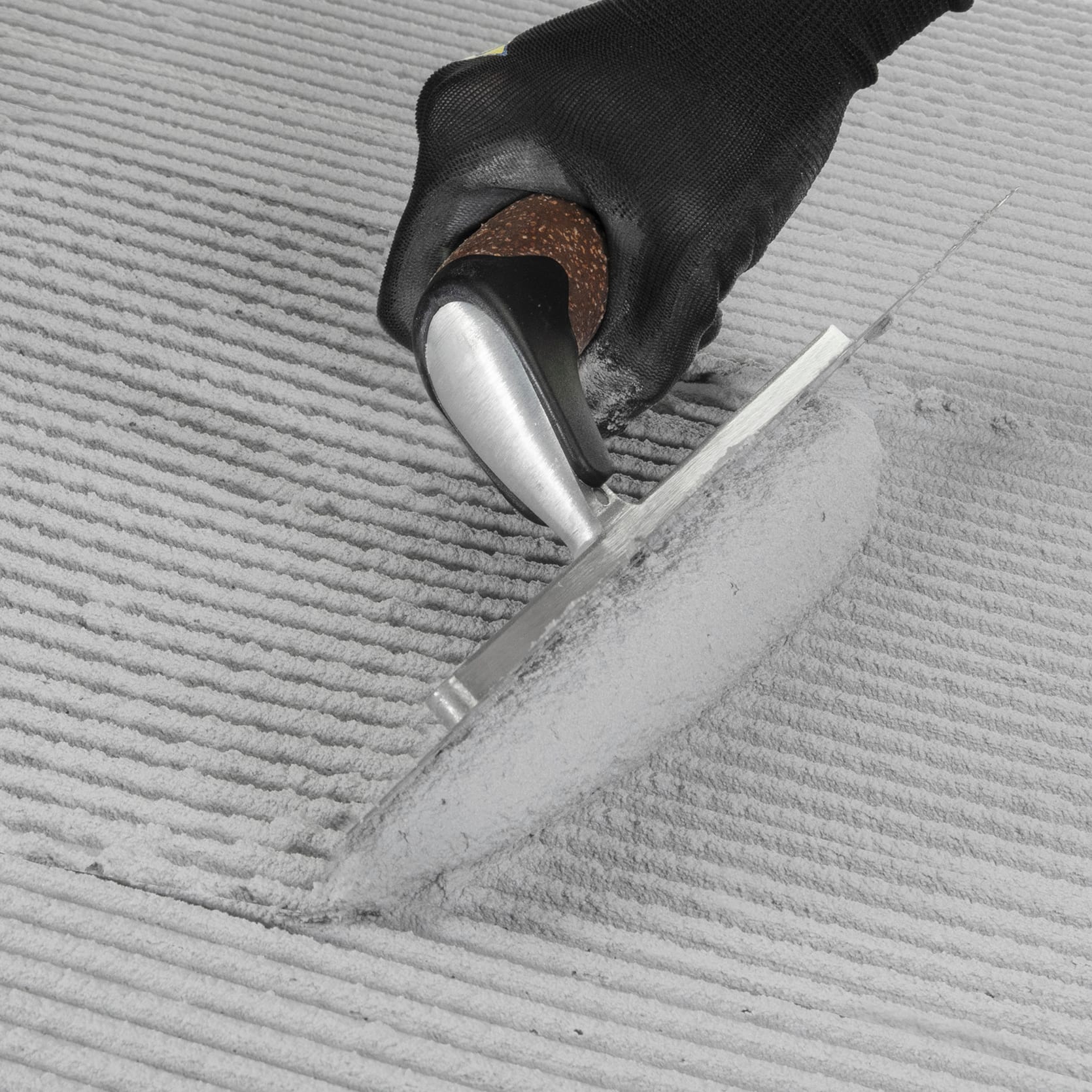 1/4" x 3/8" x 1/4" Cork Handle XL Square-Notch Flooring Trowel - 2