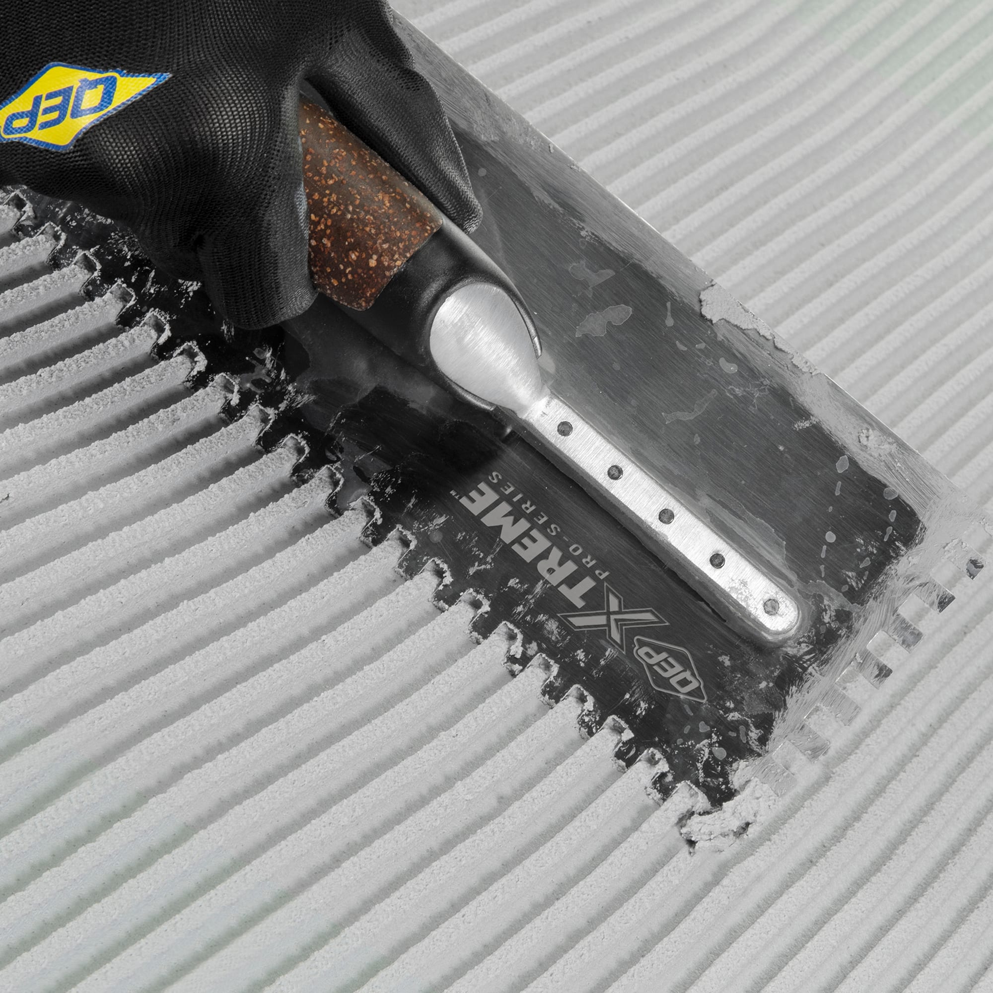 1/4" x 3/8" x 1/4" Cork Handle XL Square-Notch Flooring Trowel - 4