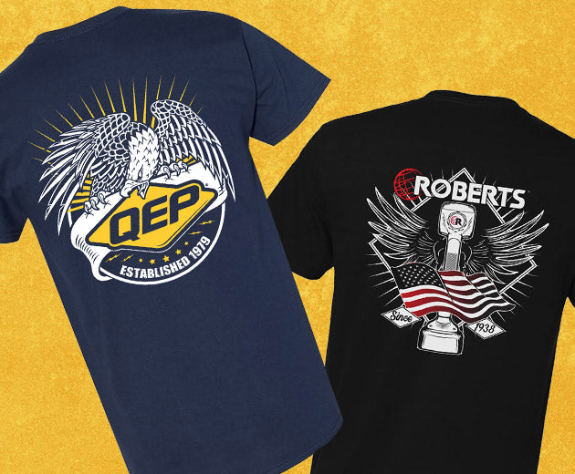 QEP Iconic Eagle Logo T-Shirt in navy blue and ROBERTS Iconic Wings and American Flag T-Shirt in black on a yellow background
