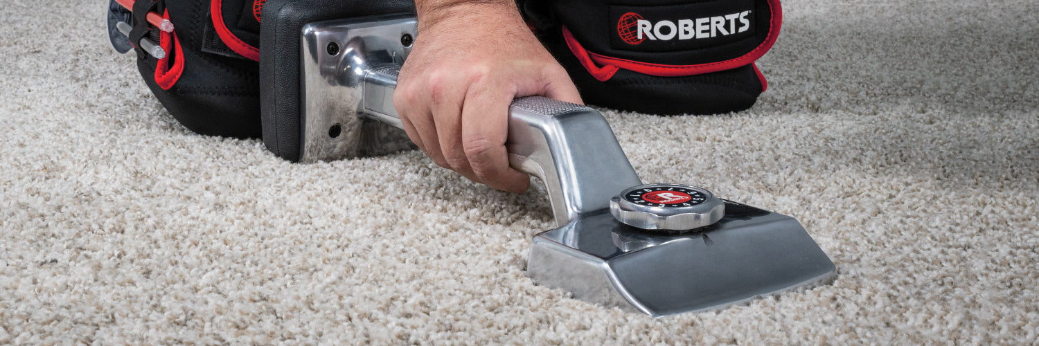 Installer using ROBERTS The General Knee Kicker to stretch the carpet in place